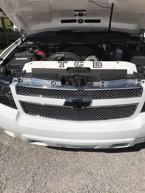 Engine bay of the 5.3L Vortec with a custom radiator cover during the build