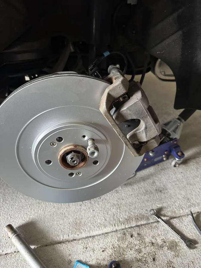 Front brake rotor and caliper replaced in a customer driveway